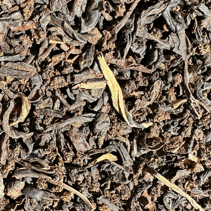 Loose leaf Weaver's Blend black tea from Porter Hill Tea Company, showcasing dark, aromatic tea leaves in a natural setting.