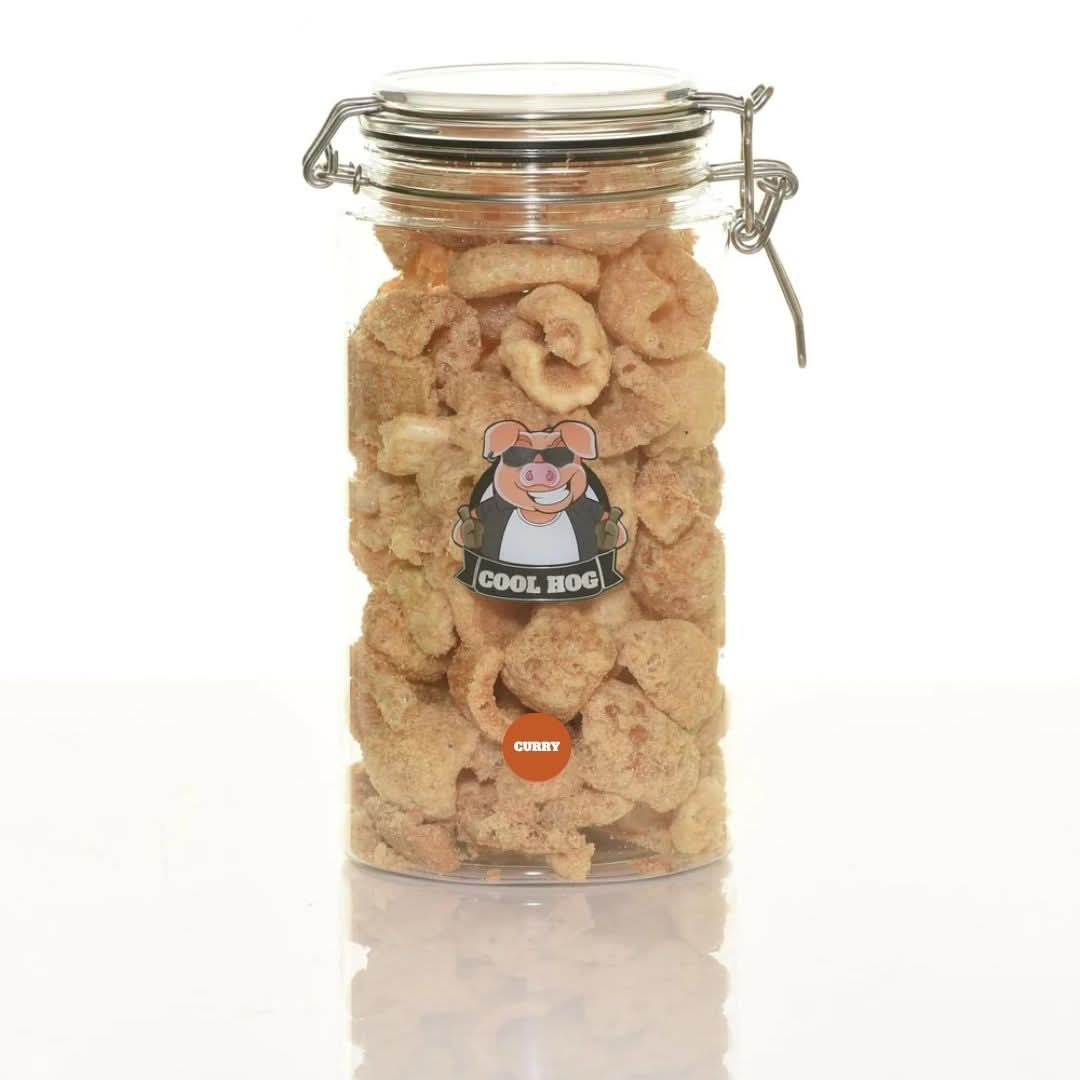 Cool Hog Snacks curry flavor pork scratching jar, showing a jar filled with crispy pork snacks with a curry seasoning coating.