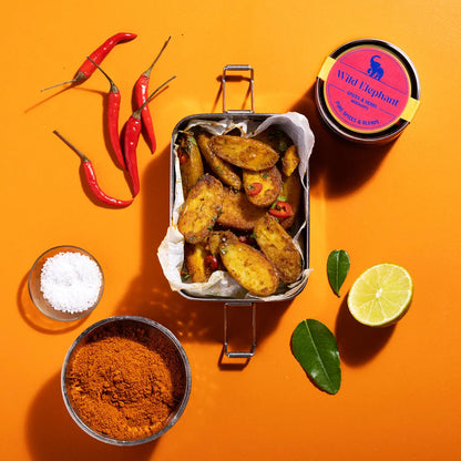Wild Elephant Bombay Curry Powder from Whole Food Earth in a spice jar, showing a vibrant yellow curry spice blend.