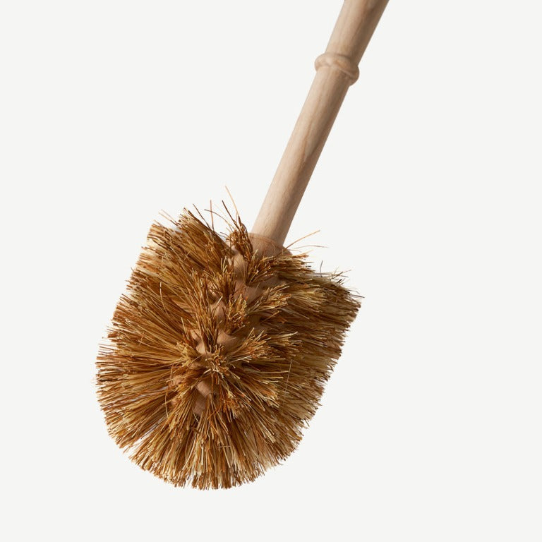 Wild and Stone plastic-free toilet brush with wooden handle and bristles, designed for eco-friendly bathroom cleaning.