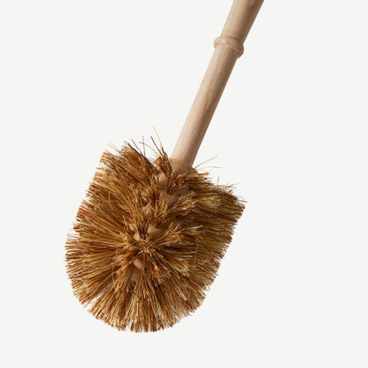 Wild and Stone plastic-free toilet brush with wooden handle and bristles, designed for eco-friendly bathroom cleaning.