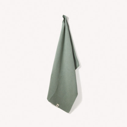 Organic cotton hand towels by Wild and Stone, soft and absorbent, featuring a neutral color and textured weave.