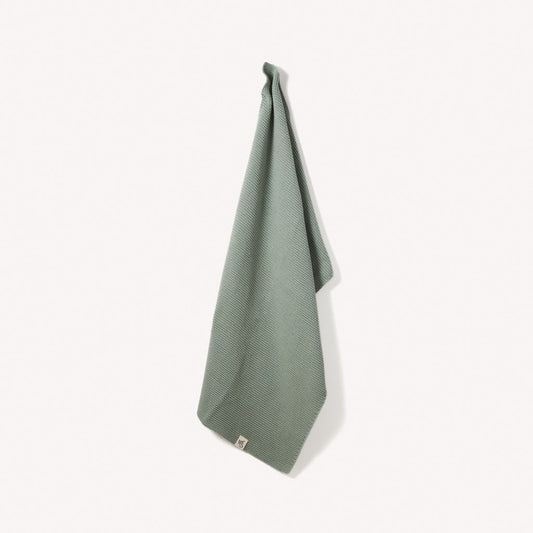Organic cotton hand towels by Wild and Stone, soft and absorbent, featuring a neutral color and textured weave.