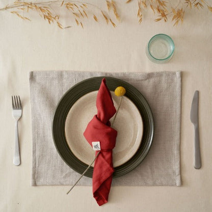Set of four organic cotton napkins by Wild and Stone, soft natural fabric with stitched edges for elegant table setting.