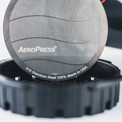 Stainless steel AeroPress filter cap from Contact Coffee Company Ltd. designed for use with AeroPress coffee makers.