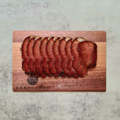 British Charcuterie Pizza Pack featuring Bray Cured air-dried ham slices on a wooden board with assorted charcuterie selection
