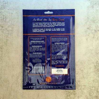 Bray Cured air-dried ham pack showing thinly sliced, high-quality charcuterie ham with marbled texture on a white background.