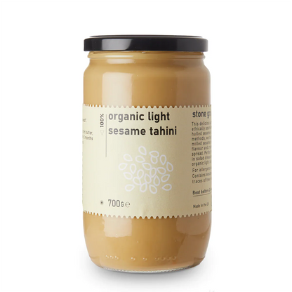 Organic Light Sesame Tahini dip from Whole Food Earth, showcasing its smooth, creamy texture and light sesame color in a jar.