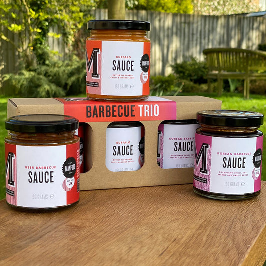 Manfood BBQ Trio gift box with three assorted barbecue sauces and rubs displayed in an appealing package.