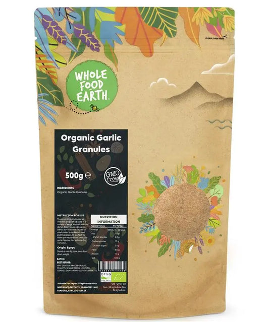 Organic garlic granules from ArtisanBox, close-up of finely ground garlic in a clear jar on a wooden surface.