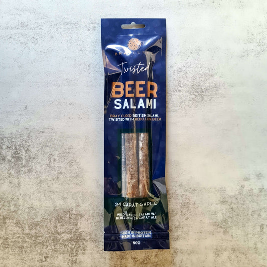 Bray Cured Beer Salami charcuterie with garlic, displayed in packaging, showcasing the flavorful sliced sausage on a wooden board.