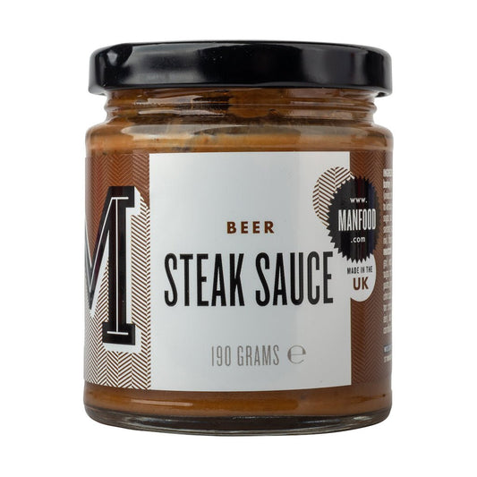 Bottle of Manfood Beer Steak Sauce, a savory sauce with a rich, dark appearance, perfect for enhancing grilled steaks.