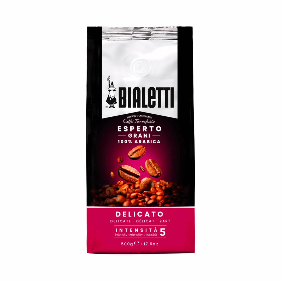 Bialetti Whole Bean Coffee by Brew Italia featuring a close-up of freshly roasted coffee beans labeled Delicato.