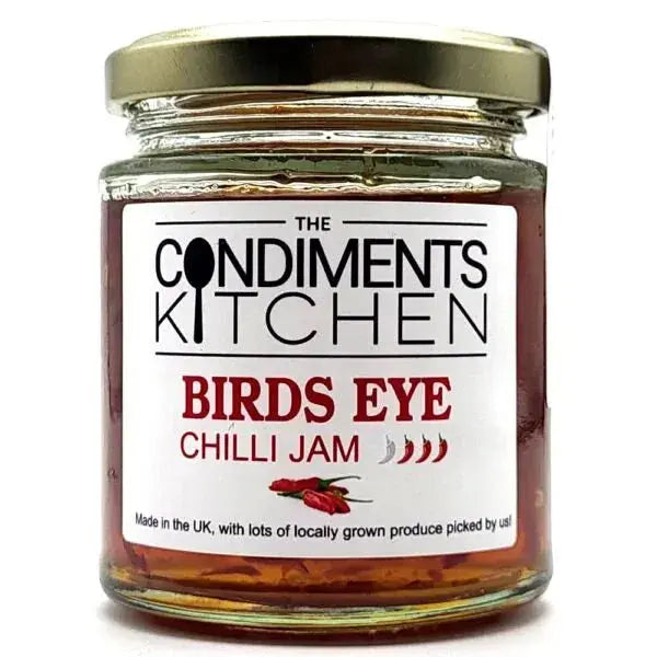 Birds Eye Chilli Jam by The Condiments Kitchen in a 200g jar, showing vibrant red chilli jam with a glossy texture.