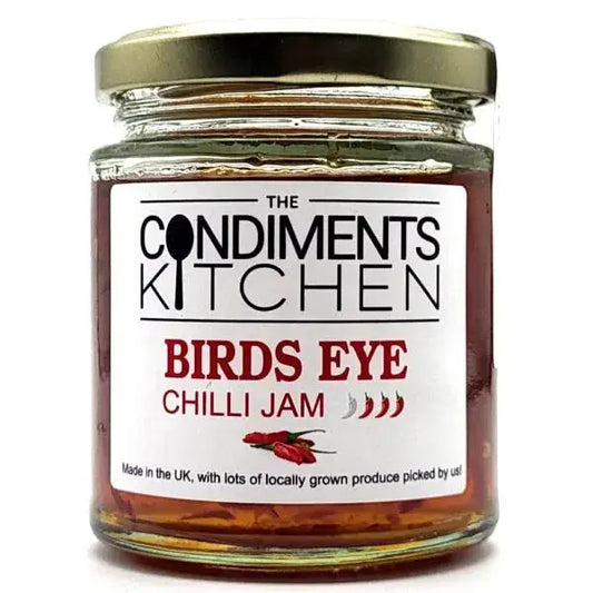 Birds Eye Chilli Jam by The Condiments Kitchen in a 200g jar, showing vibrant red chilli jam with a glossy texture.