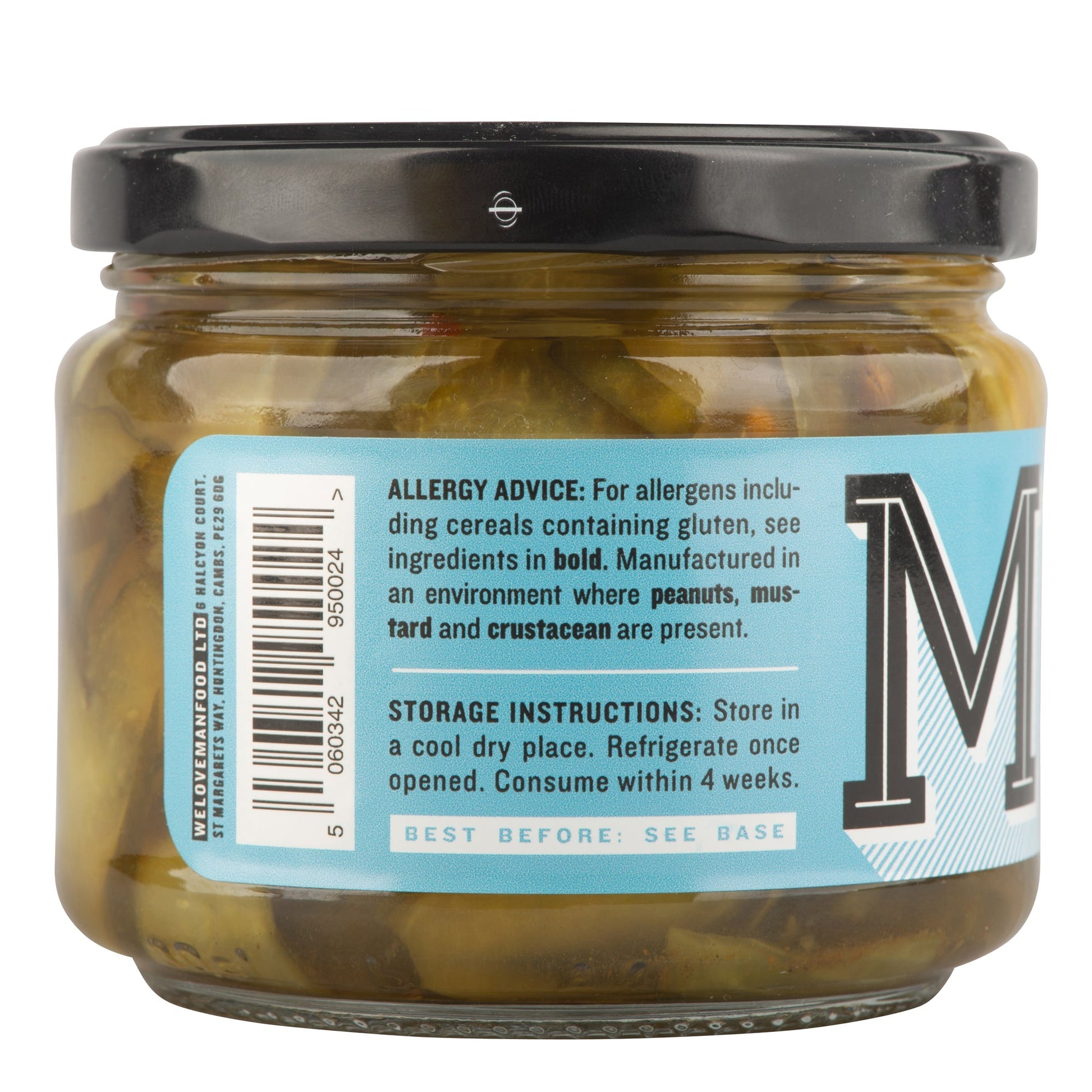 Jar of Manfood bread and butter pickles with sliced cucumbers and spices in a glass jar on a wooden surface.