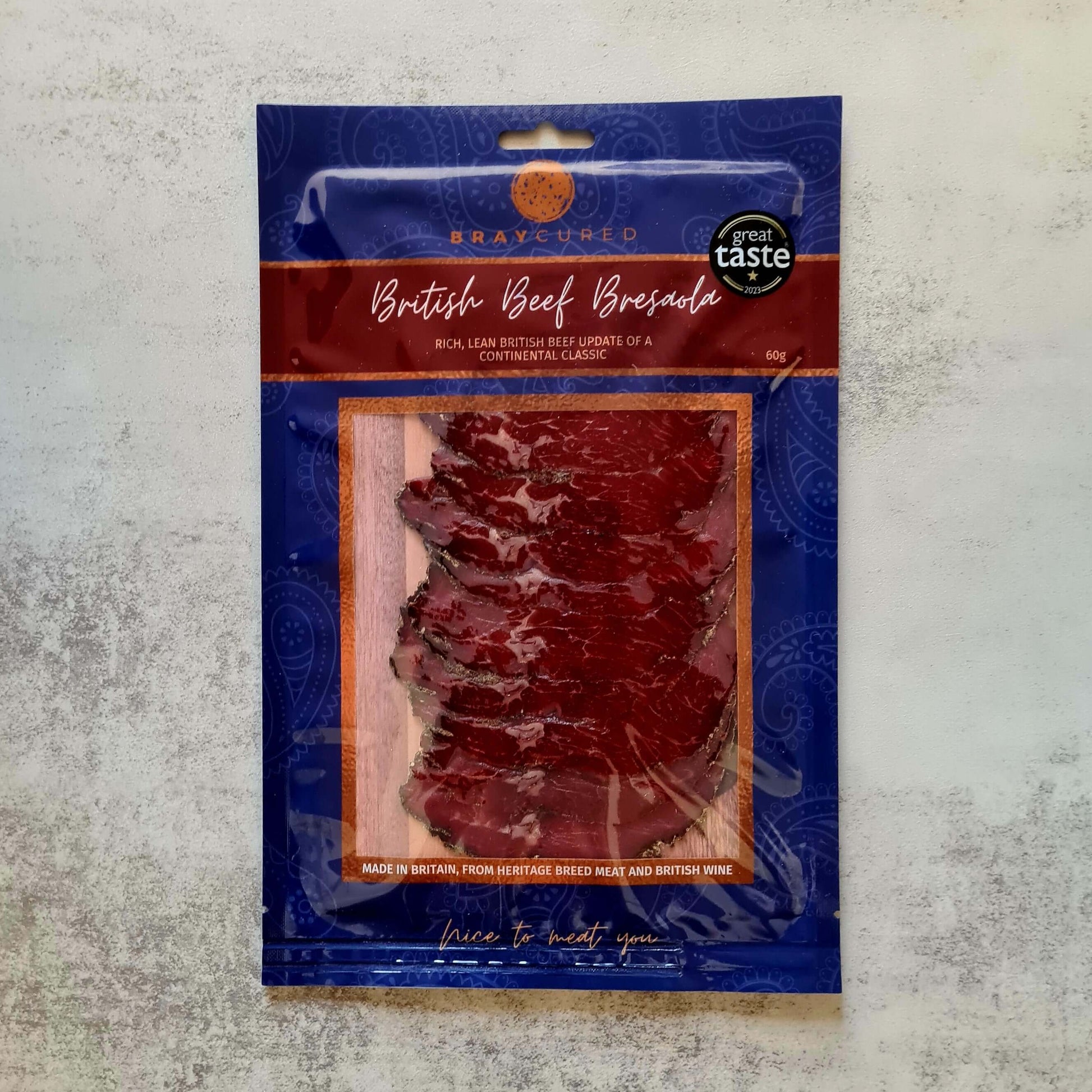 Britain beef bresaola pack from Bray Cured in a British charcuterie pizza selection, showcasing thinly sliced cured beef.