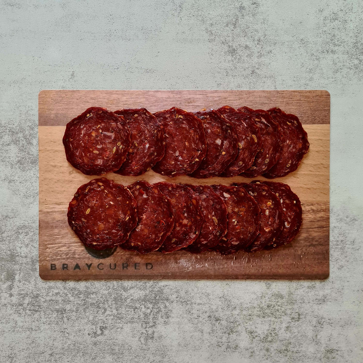 British Pepperoni charcuterie board featuring Bray Cured British beef pepperoni slices arranged with accompaniments.