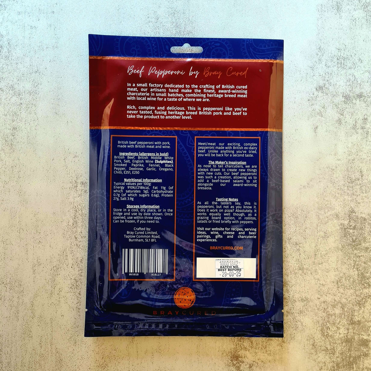 Back view of Bray Cured British Pepperoni charcuterie pack showing slices of cured beef pepperoni on a tray.
