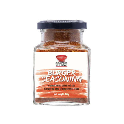 Close-up of GOODNESS IN A BOWL burger seasoning rub in a jar, showcasing the flavorful blend ideal for seasoning burgers.