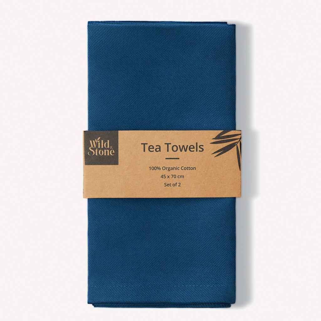 Set of two Wild and Stone organic cotton tea towels with herringbone weave, showcasing their soft texture and stylish design.