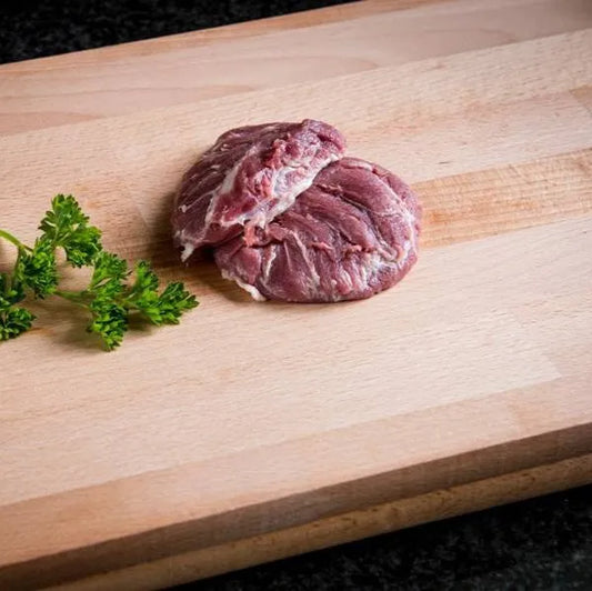 Pork cheek muscles from Primrose Herd, raw pork cheeks with marbled meat and connective tissue ready for cooking.