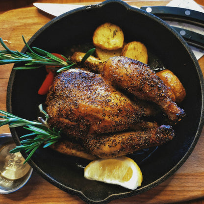 Close-up of GOODNESS IN A BOWL chicken seasoning rub in a jar, showing the seasoned spice blend for chicken dishes.
