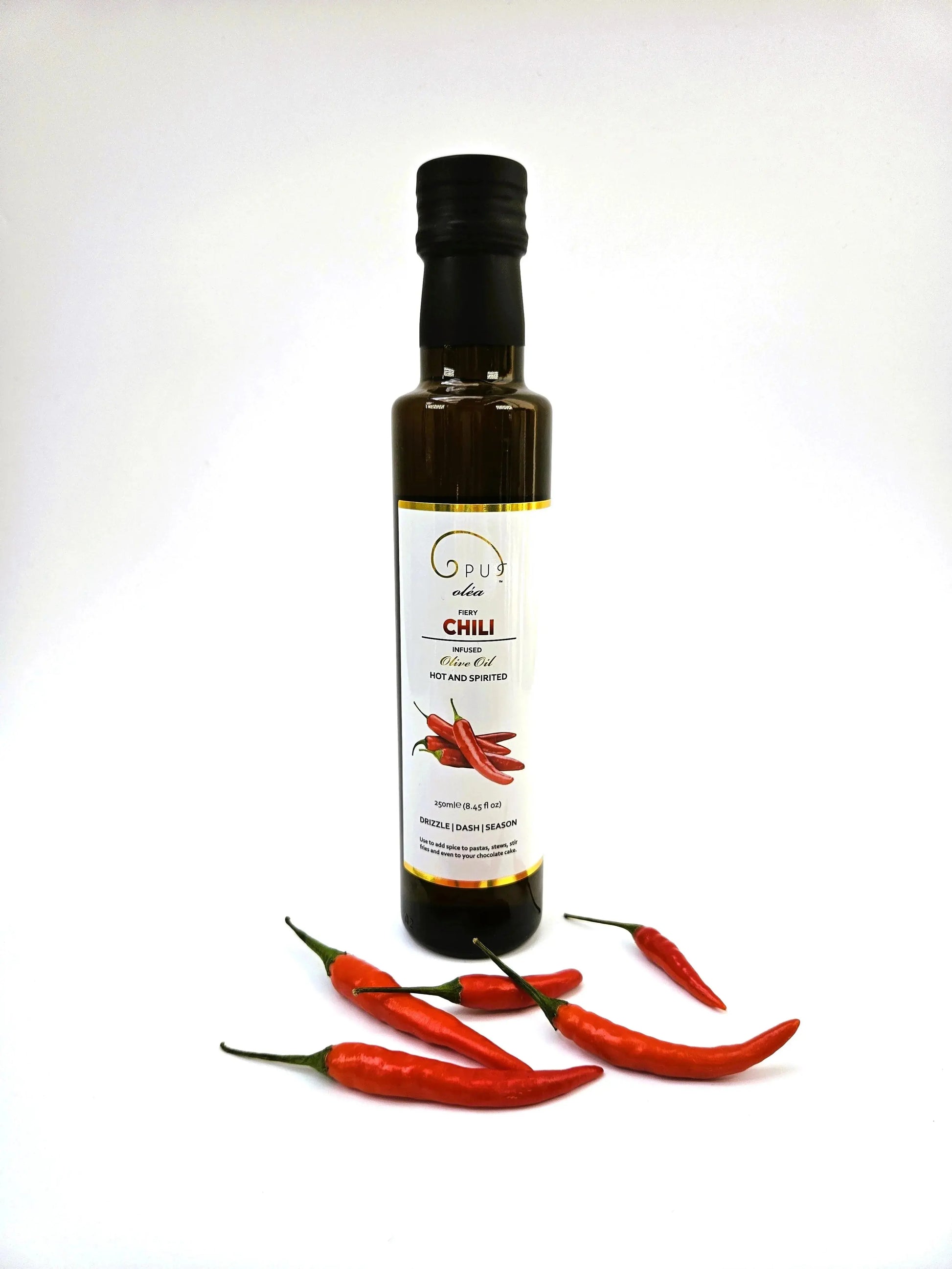 Opus Oléa Chili Olive Oil 250ml bottle with chili peppers and pods, showcasing a vibrant, flavorful infused olive oil.