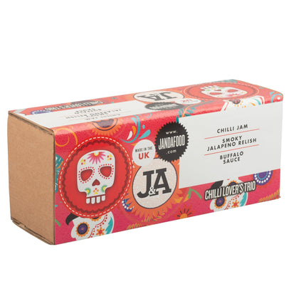 Janda Chilli Lover's Trio gift box with three varieties of spicy chili products, vibrant packaging and fresh chili peppers inside.