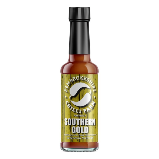 Southern Gold Chilli Sauce by Pembrokeshire Chilli Farm, vibrant orange chili sauce in a glass bottle with label.