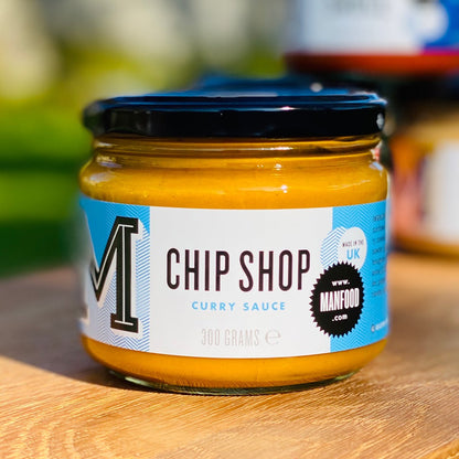 Manfood Chip Shop Curry Sauce in a jar, showcasing its rich, smooth sauce ideal for dipping or pouring over dishes.