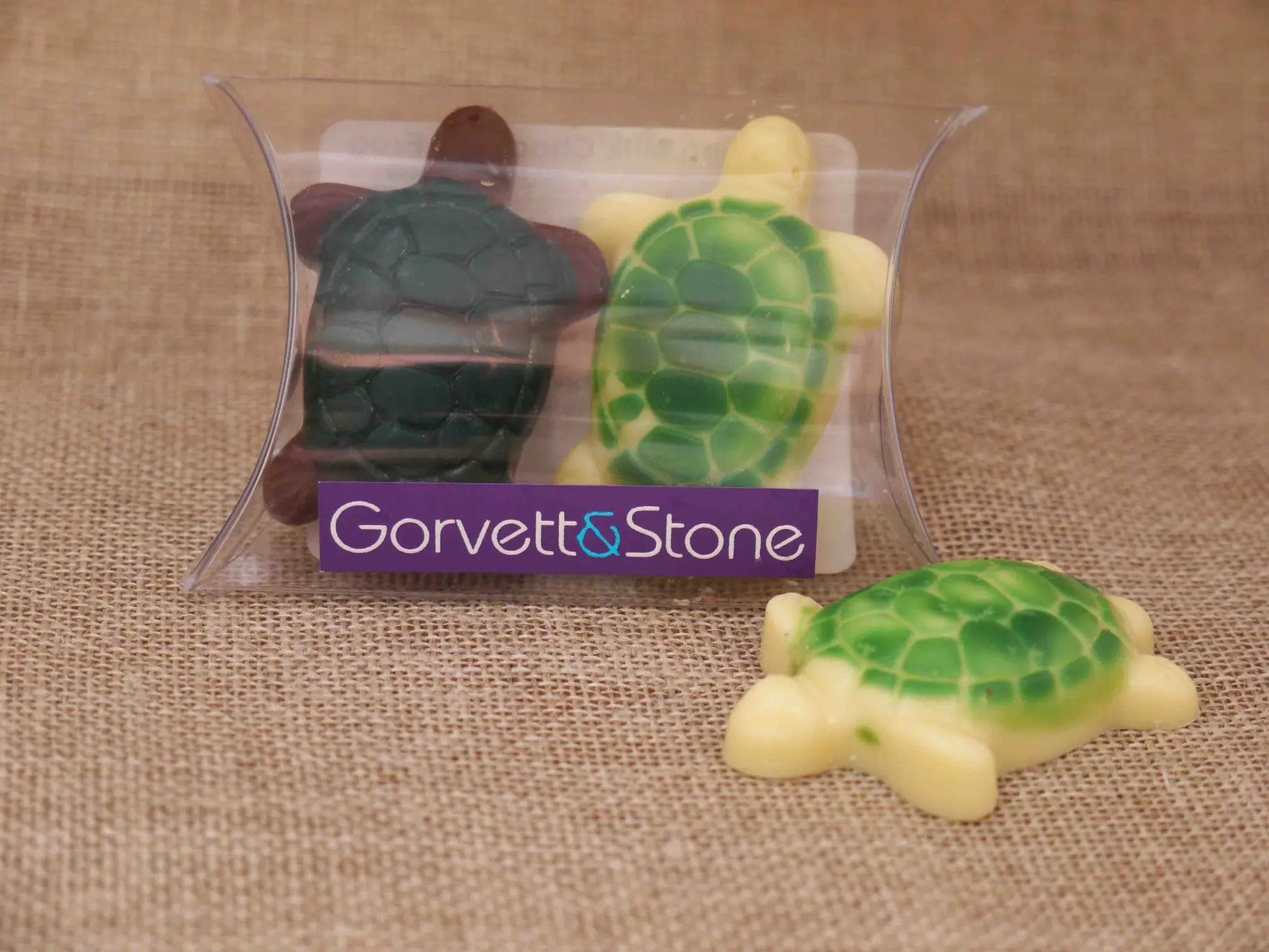 Gorvett & Stone milk and white chocolate turtles arranged on a plate, showcasing detailed turtle shapes and glossy finish.