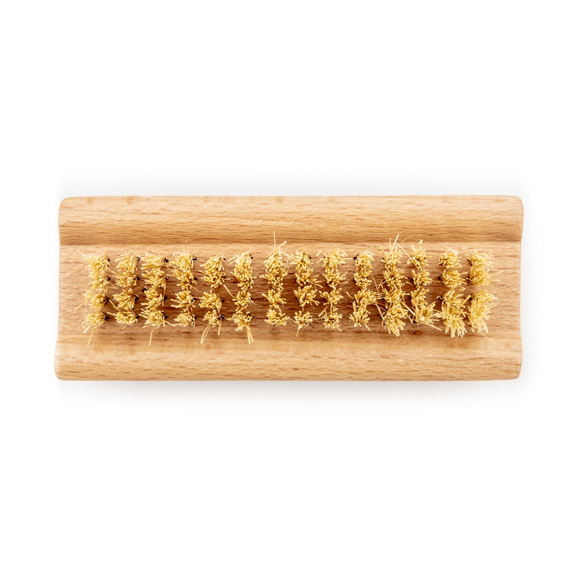 Wild and Stone biodegradable natural bristle nail brush with wooden handle for gentle nail cleaning and maintenance.
