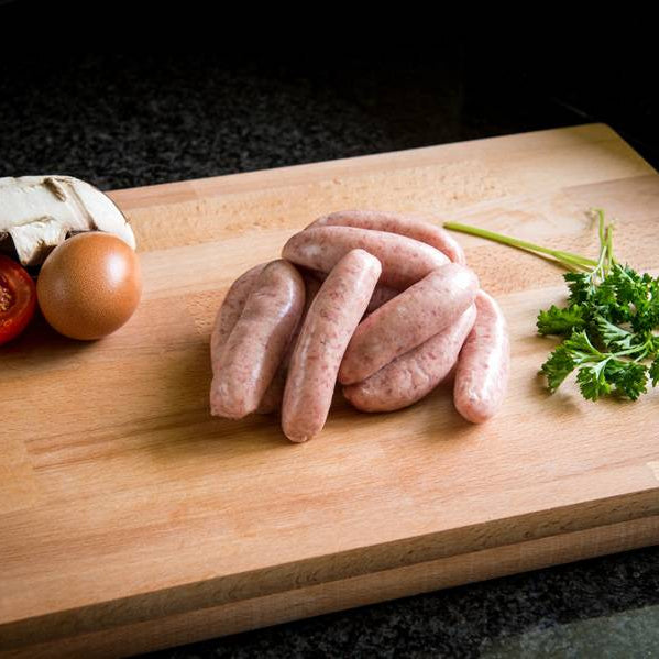 Primrose Herd Cornish gluten-free heritage pork cocktail sausages in a 500g package, ready for cooking or serving.