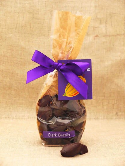 Bag of Gorvett & Stone Brazil chocolates, milk chocolate-covered Brazil nuts and fruits in a dark bag.