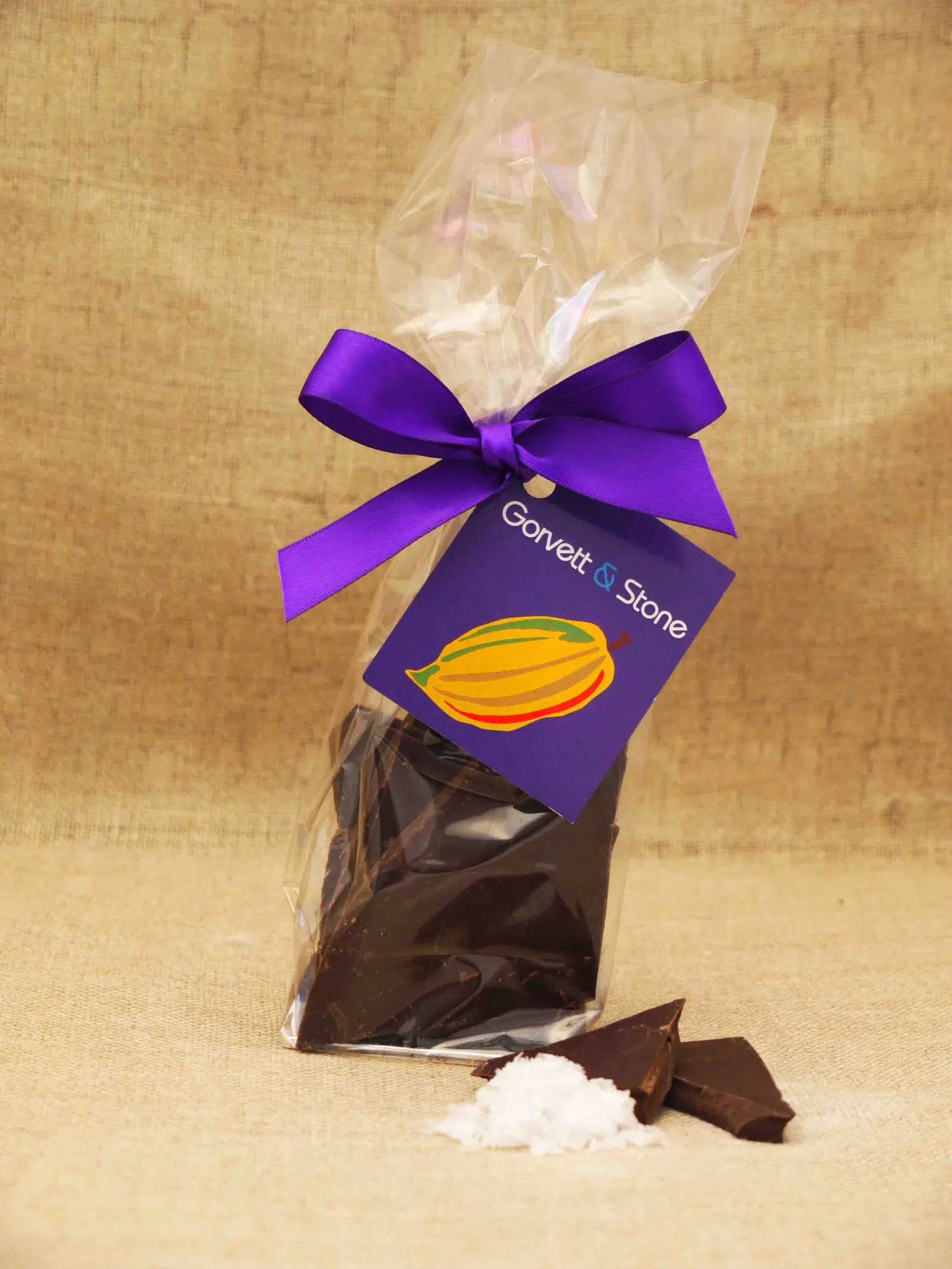 Dark chocolate shards with sea salt from Gorvett & Stone, showcasing glossy chocolate pieces sprinkled with sea salt crystals.