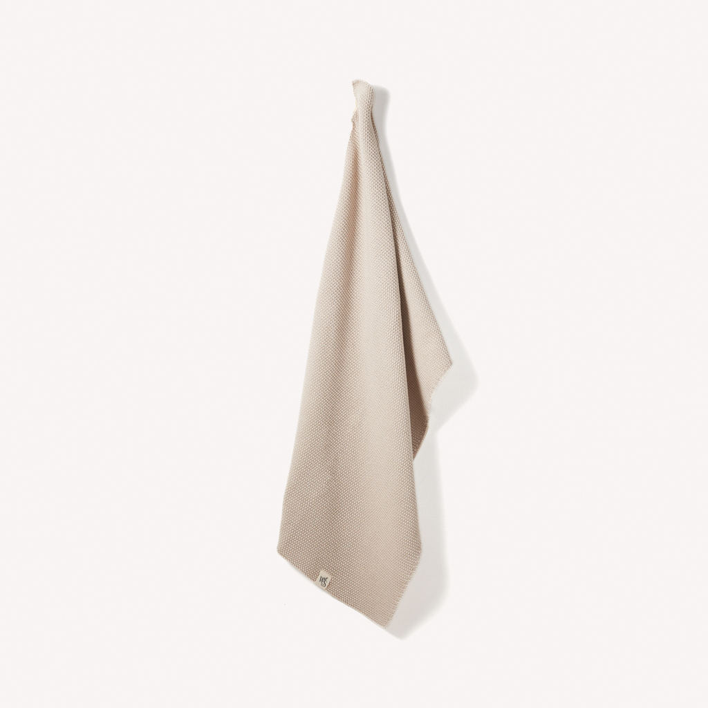 Organic Cotton Hand Towels by Wild And Stone, soft and absorbent, displayed hanging with natural texture and neutral tones.