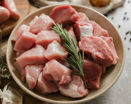 Cubed diced pork from Primrose Herd, showing fresh, evenly cut pork meat ideal for cooking or meal preparation.