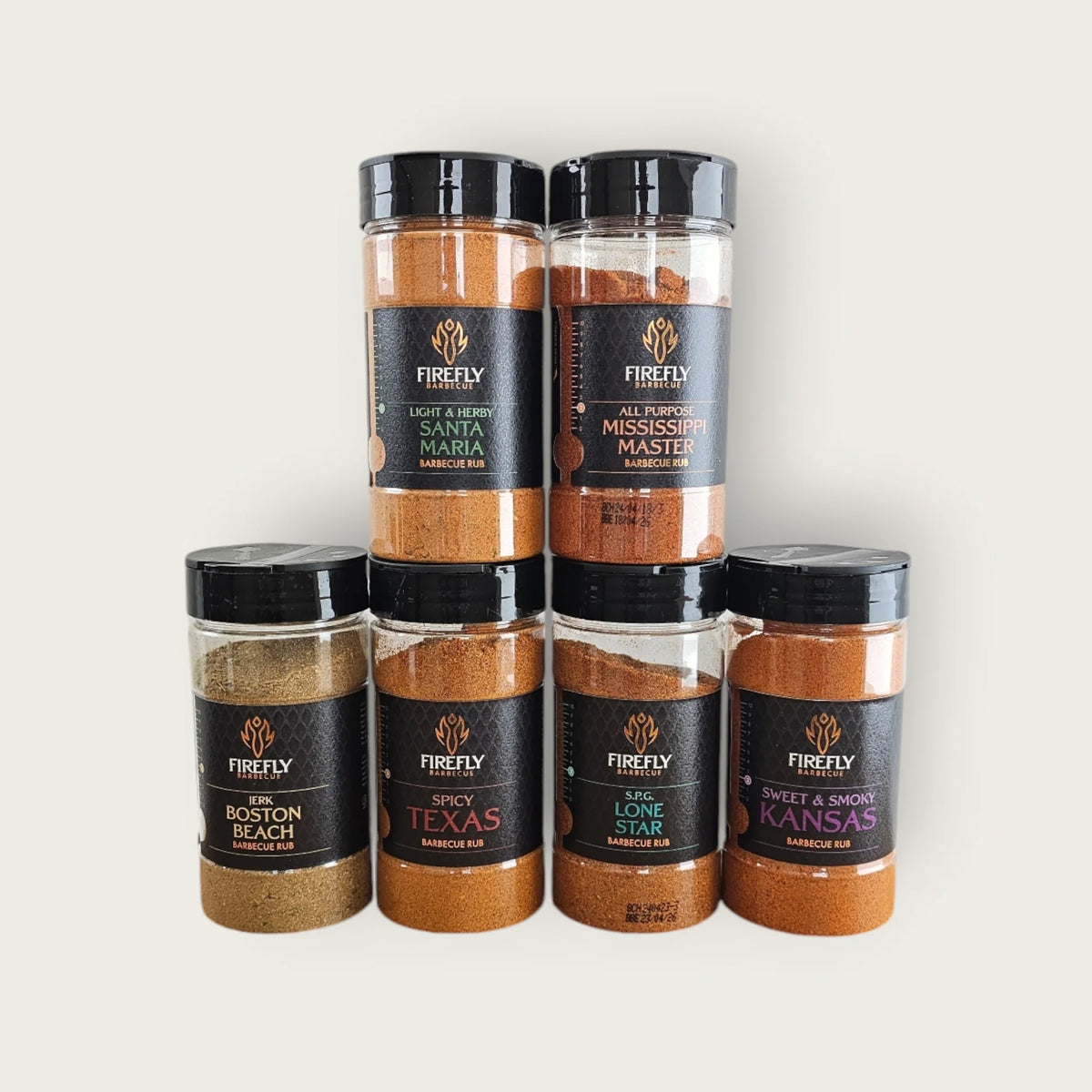 FireFly Barbecue American BBQ Rub gift set with six jars, featuring a variety of smoky, savory seasonings for grilling.