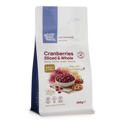 Whole Food Earth dried cranberries, sliced and whole, in a clear container, showcasing vibrant red dried fruit pieces.