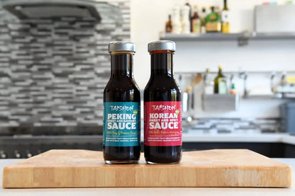 Taishon vegan Peking and Korean sauce mixed twin pack featuring two condiment bottles on a lifestyle background.