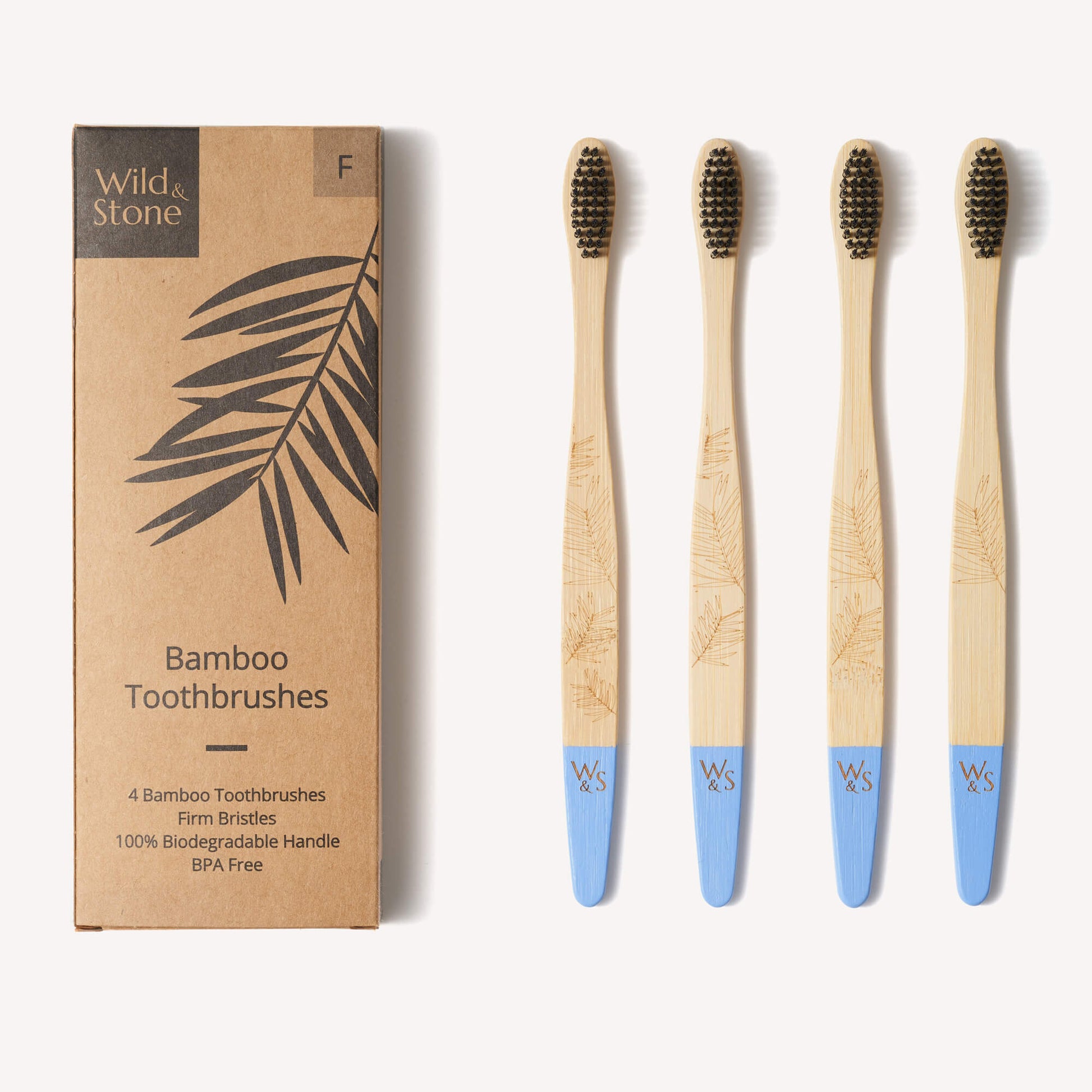 Adult bamboo toothbrush with firm bristles in a 4-pack by Wild And Stone, featuring eco-friendly bamboo handles and natural bristle heads.