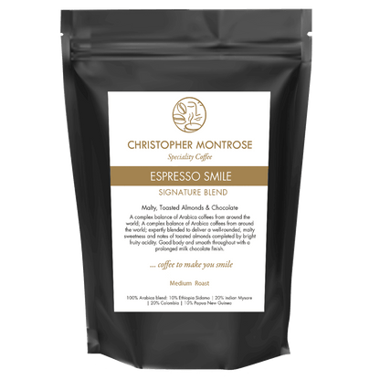 Transparent image of Christopher Montrose Coffee Arabica Espresso Smile coffee beans in a close-up view.