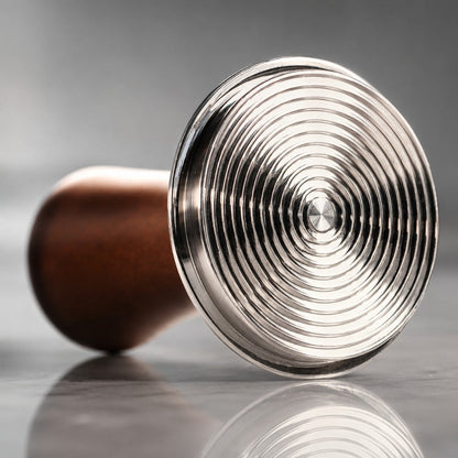 KNOCDIC® espresso tamper with spring-loaded base on a coffee setup, featuring a sleek handle and stainless steel design.