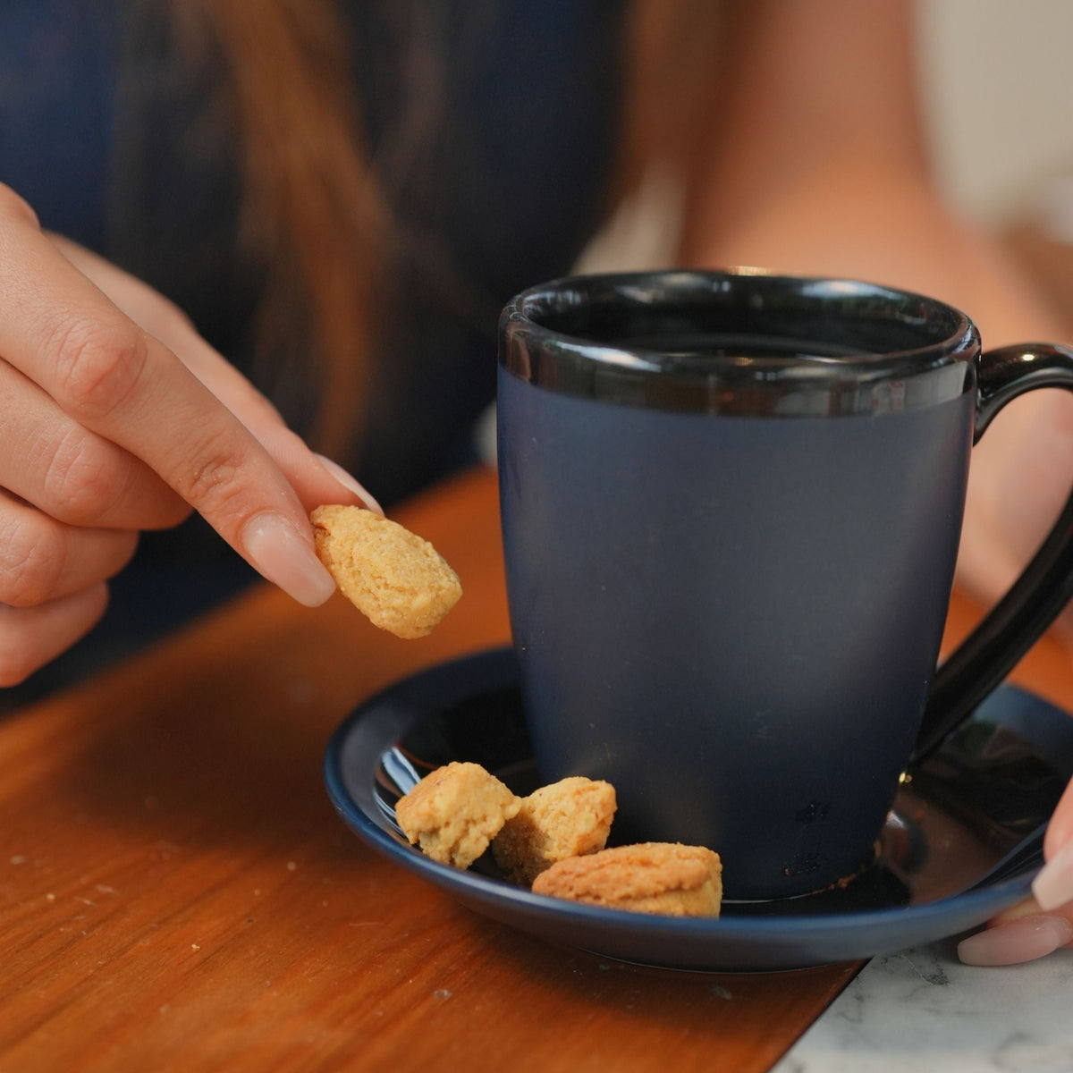 EverFree gluten-free hazelnut cookie with a golden-brown crust and visible hazelnut pieces on a white background.