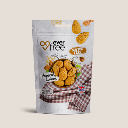 Three packs of EverFree gluten-free hazelnut cookies, 60g each, with visible hazelnut pieces and crisp cookie texture.