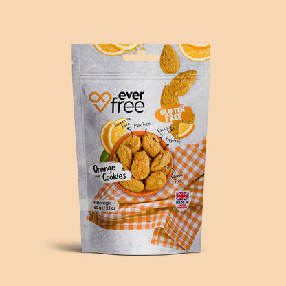 Three packs of EverFree gluten-free orange cookies, 60g each, showcasing vibrant orange-flavored cookies in clear packaging.