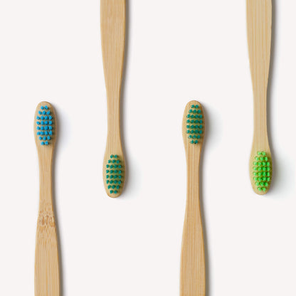 Children's bamboo toothbrushes in aqua color, Wild and Stone 4-pack, eco-friendly toothbrushes for kids with soft bristles.