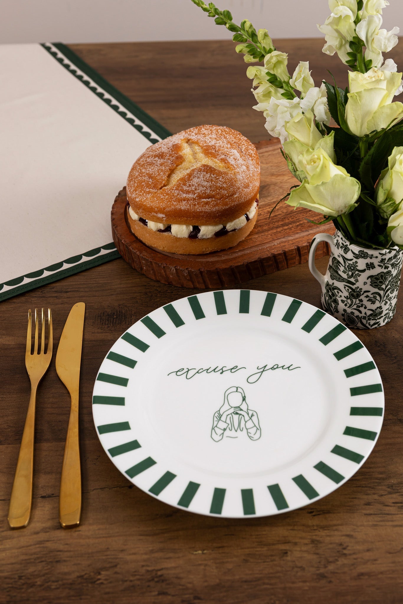 Bone china plate with "Excuse You" design by Avalon Home UK, shown on a table with a decorative setting.