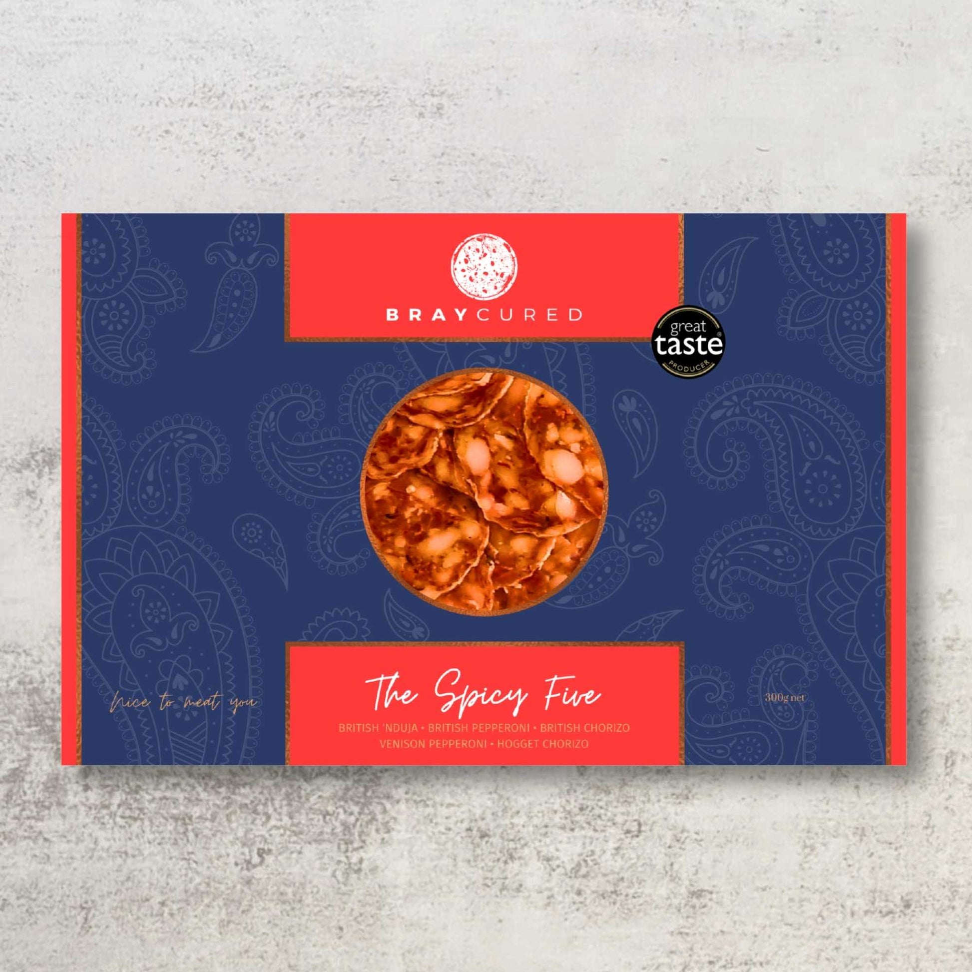 Bray Cured Spicy Feasting Five charcuterie selection featuring spicy cured meats and accompaniments on a wooden board.